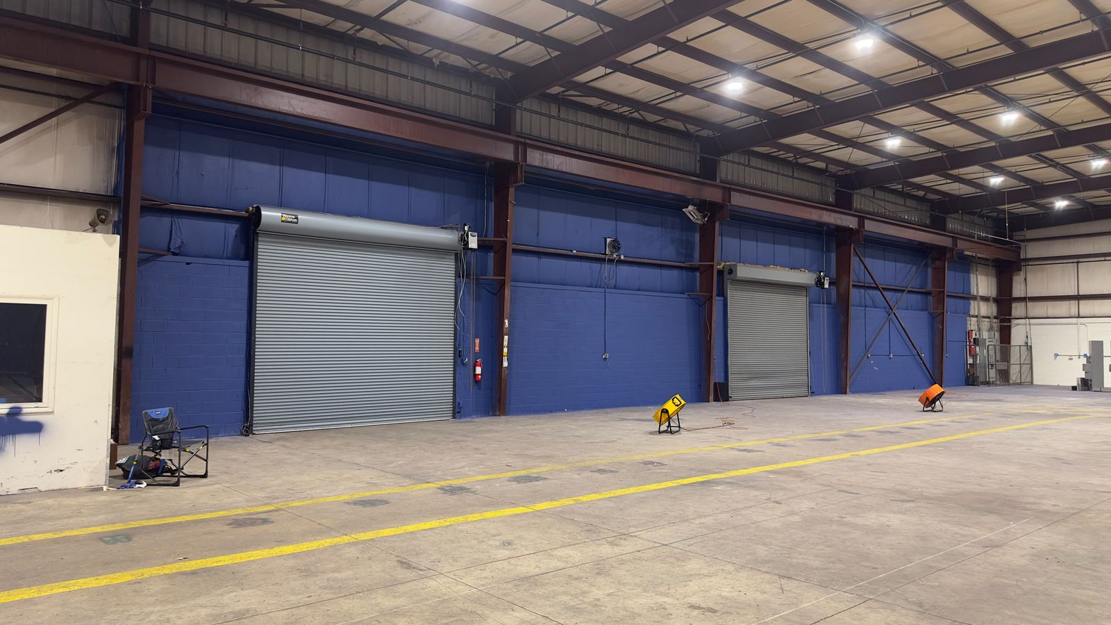Wide view of the finished blue court walls inside the facility